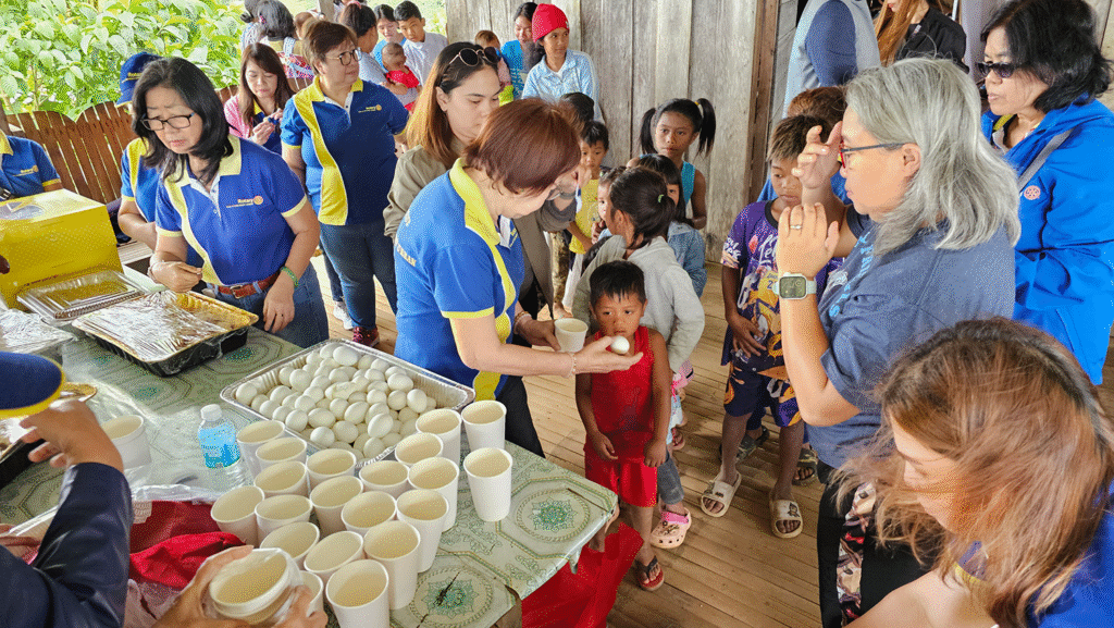distribution of food for the children. warm congree and egg. A full lunch was also served followed with ice cream and snack treats.