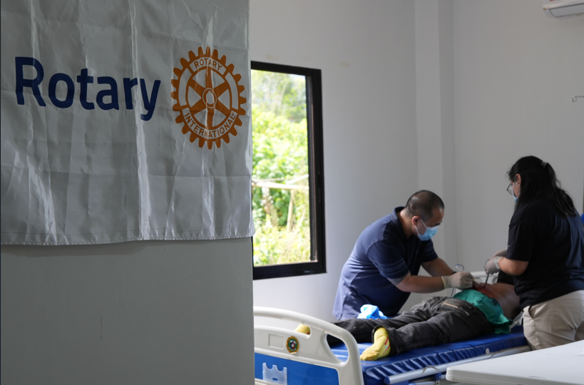 Project HOPE medical volunteers performing a minor surgery